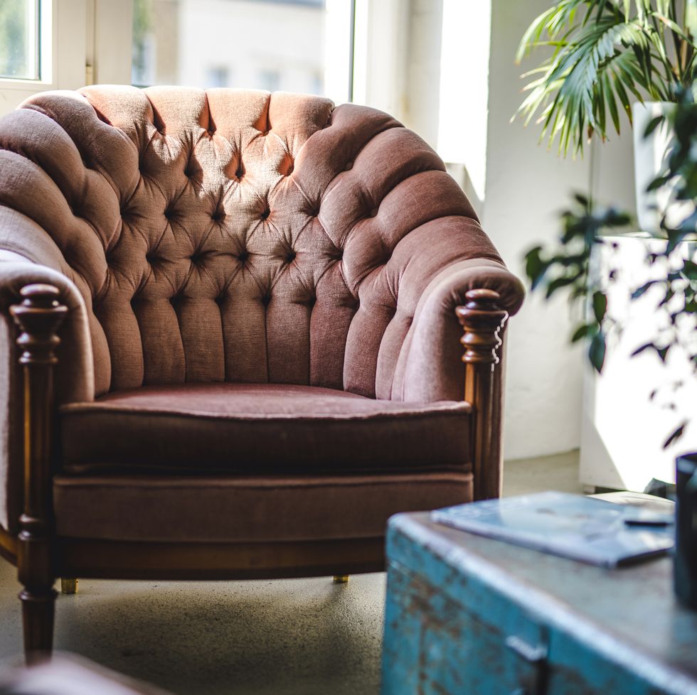 upholstered armchair and trunk in eclectic office