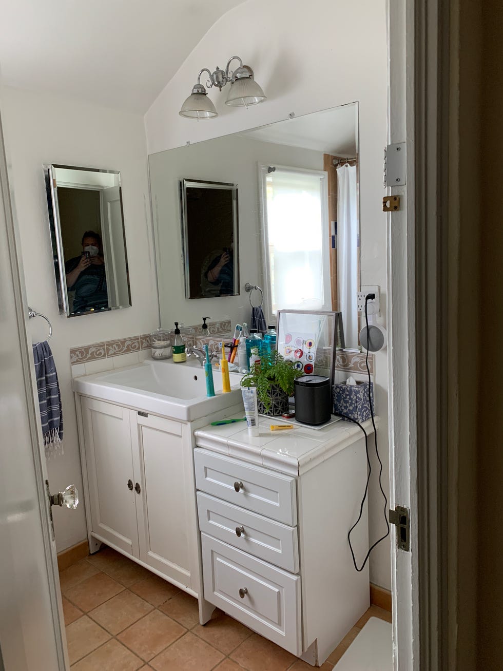 a bathroom with a mirror and sink