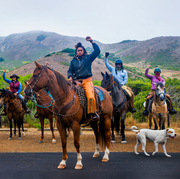 group of people with raised fists on horseback group of people with raised fists on horseback