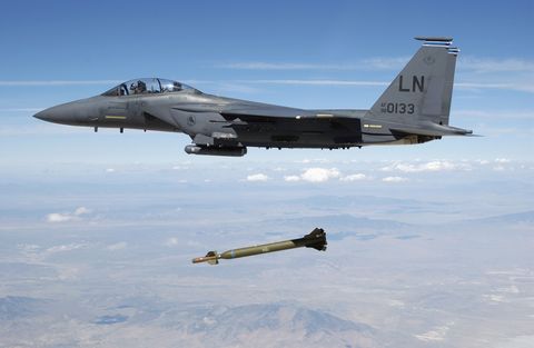 a us air force usaf f 15e strike eagle aircraft from the 492nd fighter squadron, royal air force raf lakenheath, united kingdom uk releases a gbu 28 bunker buster 5,000 pound laser guided bomb over the utah test and training range during a weapons evaluation test hosted by the 86th fighter weapons squadron fws from eglin afb, florida fl