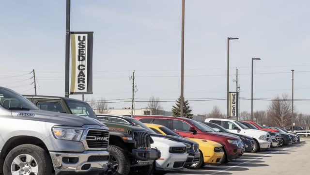 used car display at a dealership. with supply issues, used and preowned cars are in high demand.