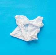 seasonal allergies or covid, used white tissues paper on blue background