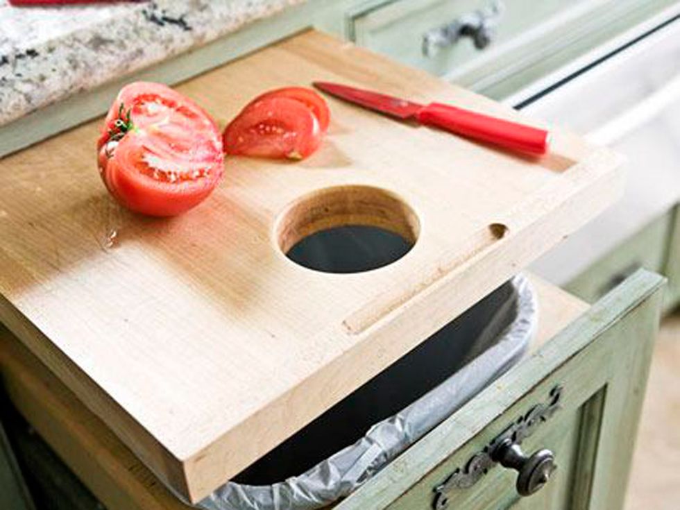 Wood, Cutting board, Table, Room, Drawer, Furniture, Kitchen, Tool, Wood stain, Tool accessory, 