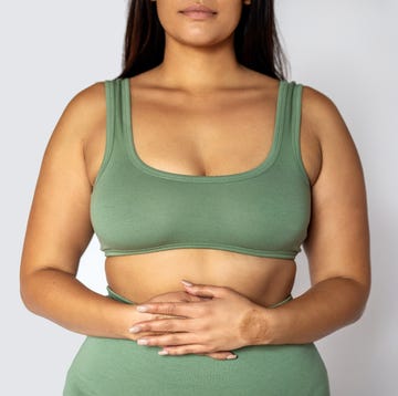 Midsection of a woman in underwear midsection shot of a woman in underwear on white background