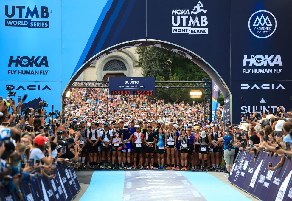 runners assemble before crowds at the start line of the utmb in chamonix