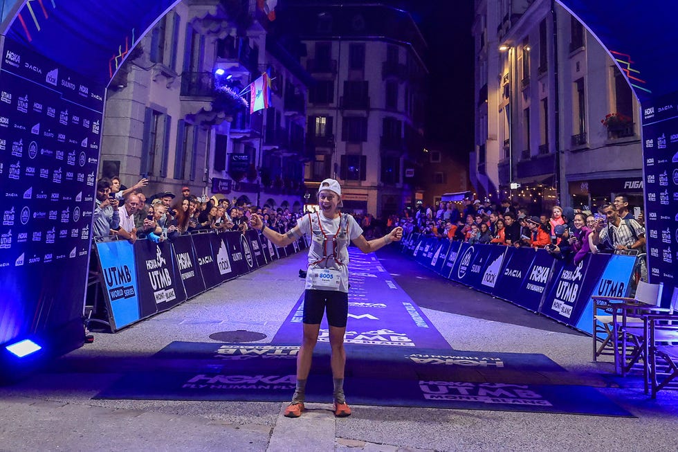 a runner celebrating at the finish line
