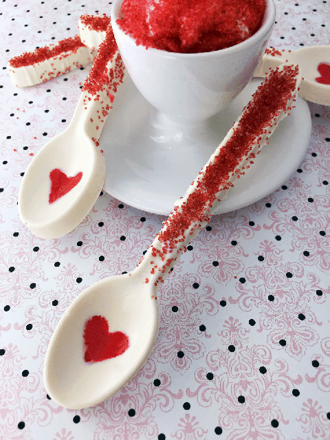 white chocolate spoons, a great baby shower idea, decorated with red sugar hearts and sugar crystals