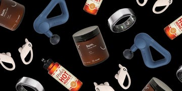 assortment of wellness and relaxation products including a massage gun a massage candle a smart ring and infused honey