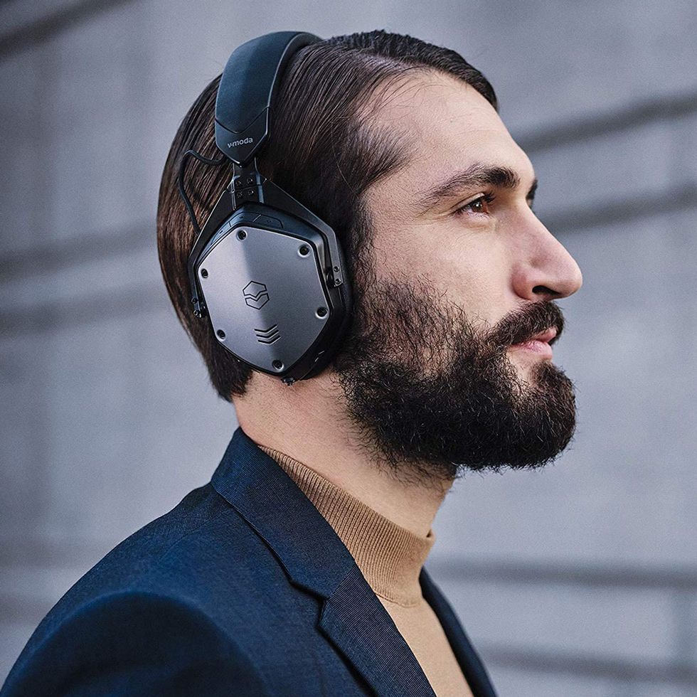 man wearing vmoda m200 anc noise cancelling wireless bluetooth overear headphones
