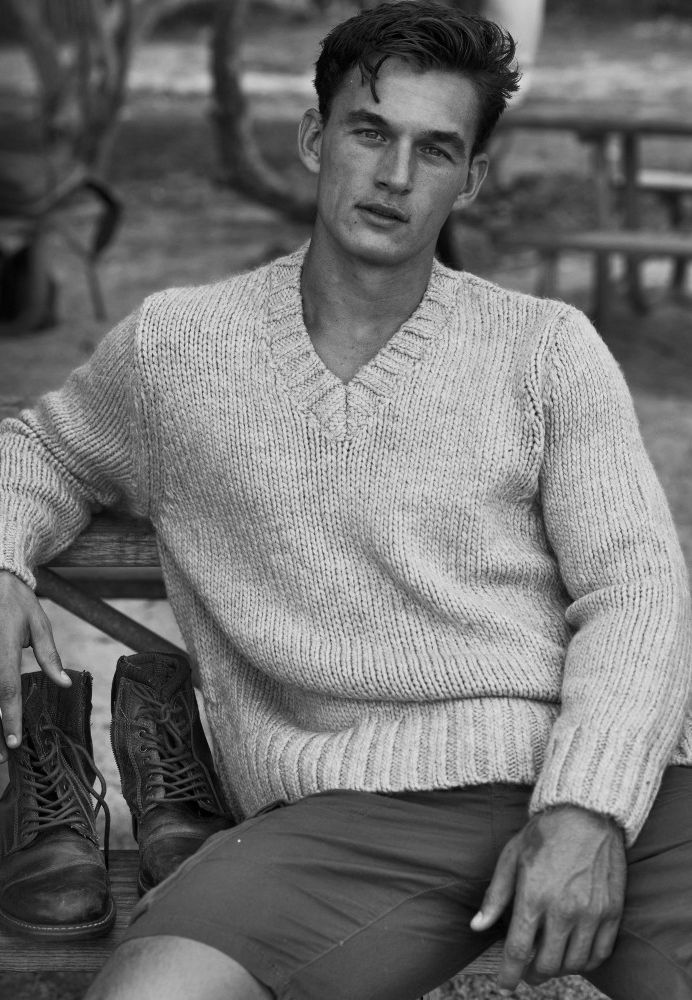 Photograph, Clothing, Sweater, Sitting, Model, Knitting, Outerwear, Muscle, Sleeve, Neck, 