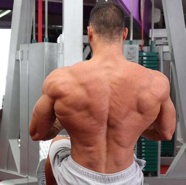 bodybuilder exercising in fitness center