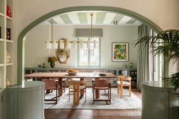 open planing dining area in soft pale green shades with striped ceiling
