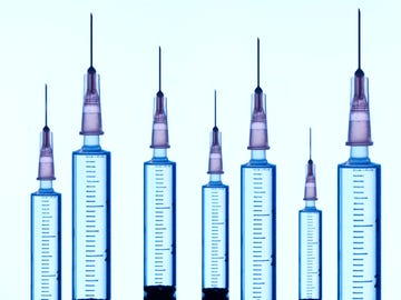 detail  close up of 7 medical syringes, macro photography 