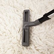 Vacuum cleaner nozzle on shag carpet