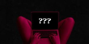 a woman holding a laptop in her lap with question marks on the screen