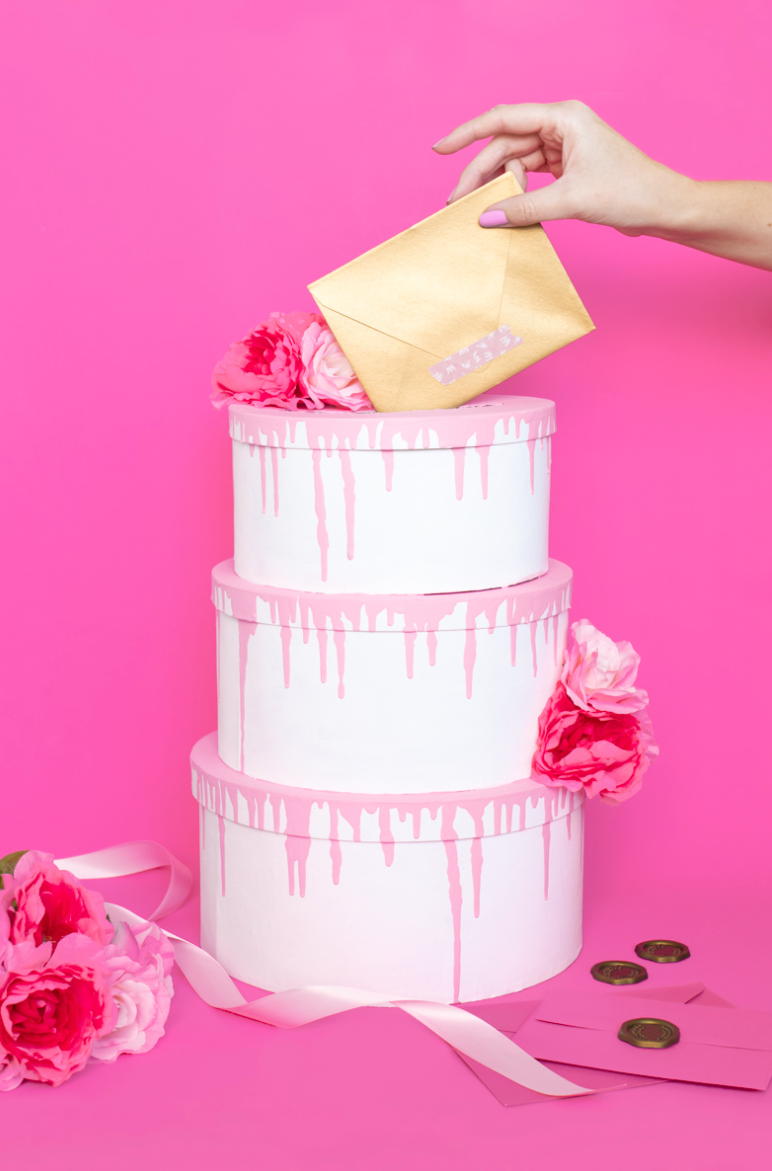 valentines card box tiered cake with hand holding envelope on top