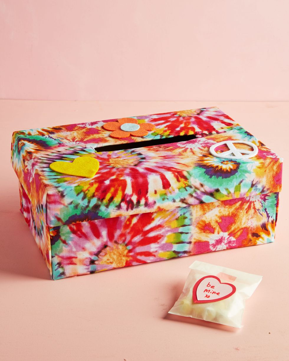 tie dye valentines day box idea wrapped in fabric and decorated wtih felt heart, flower, and peace sign decals