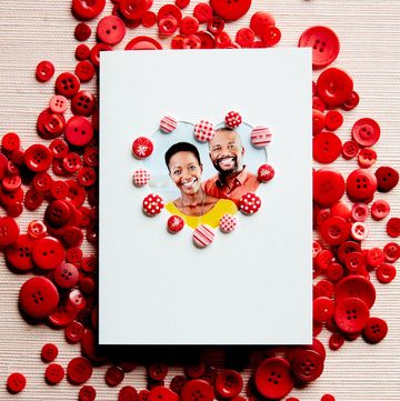 homemade valentine's day card with heart shaped photo insert of couple, decorated with cute red buttons