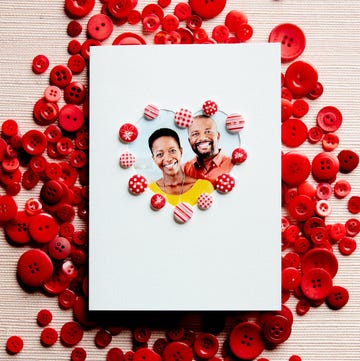 homemade valentine's day card with heart shaped photo insert of couple, decorated with cute red buttons