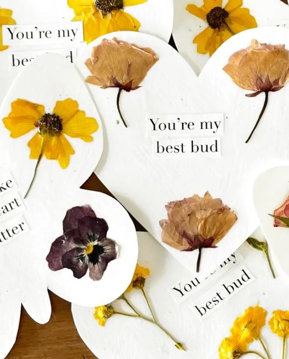 butterfly and flower shaped valentines adorned with pressed flowers that say you make my heart flutter, or you're my best bud