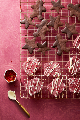 pink valentines day cookies with white chocolate drizzled on top