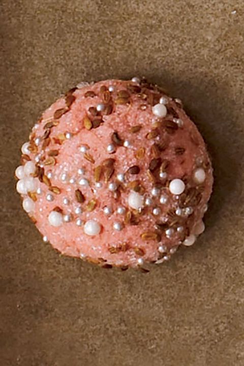 light pink cookies with sugar sprinkles pearl sprinkles and dragees