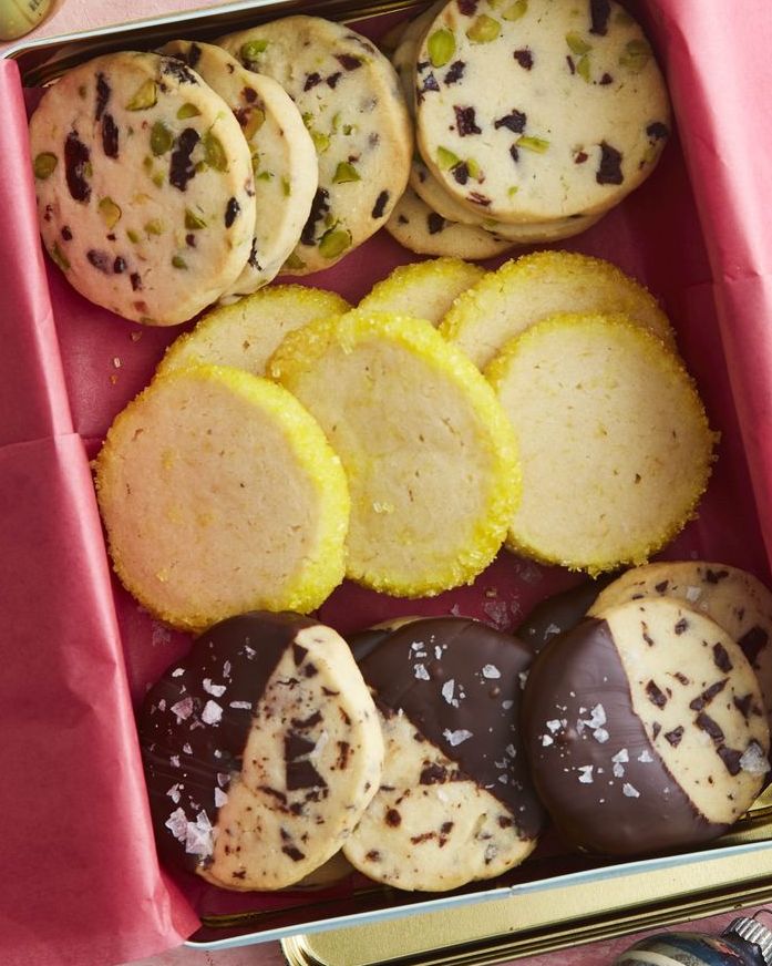 slice and bake shortbread cookies arranged in a metal tin with pink tissue paper