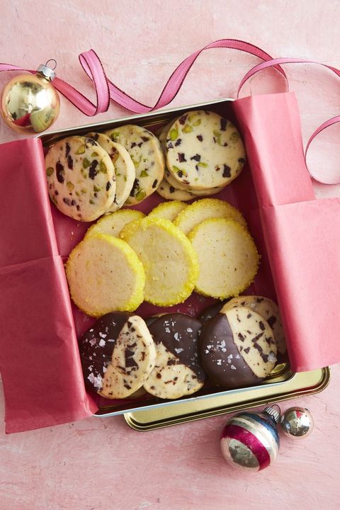 slice and bake shortbread cookies arranged in a metal tin with pink tissue paper