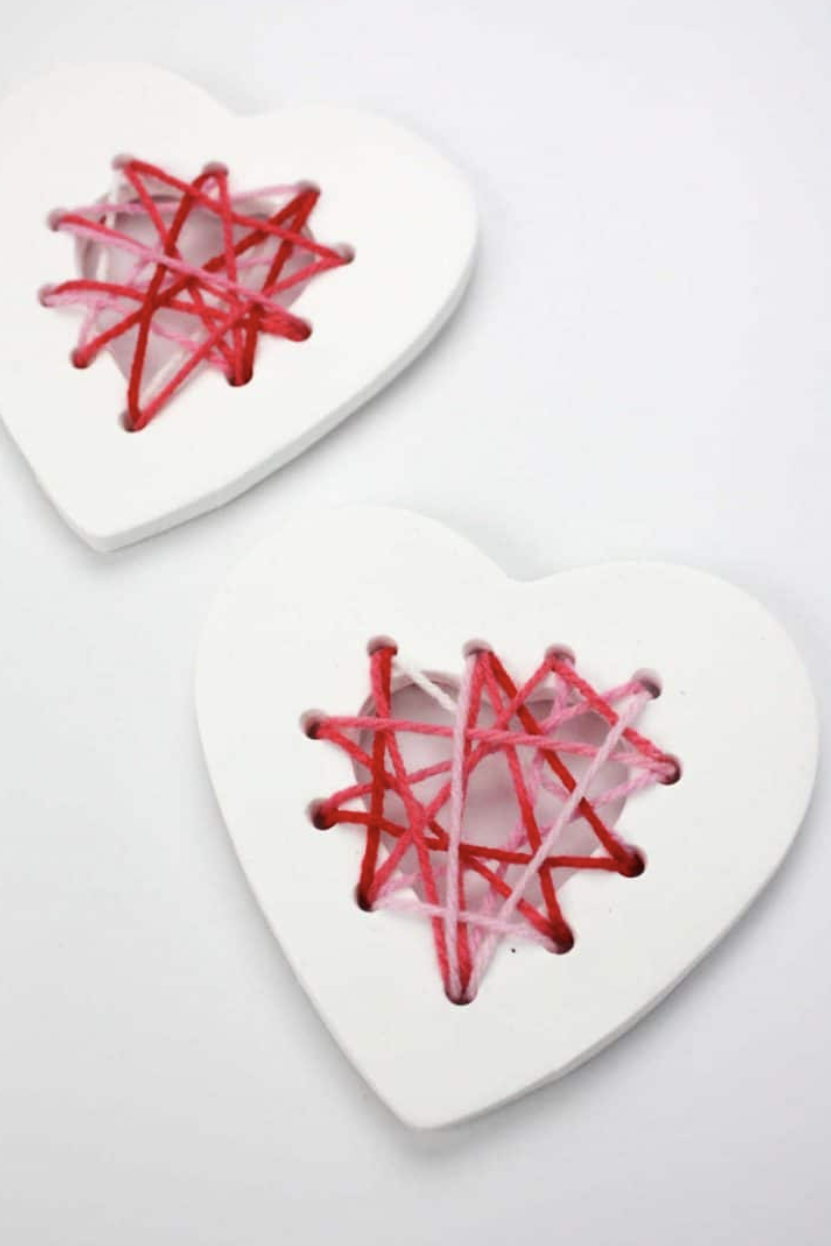 valentines day crafts air dry clay hearts  with crisis cross red and pink thread
