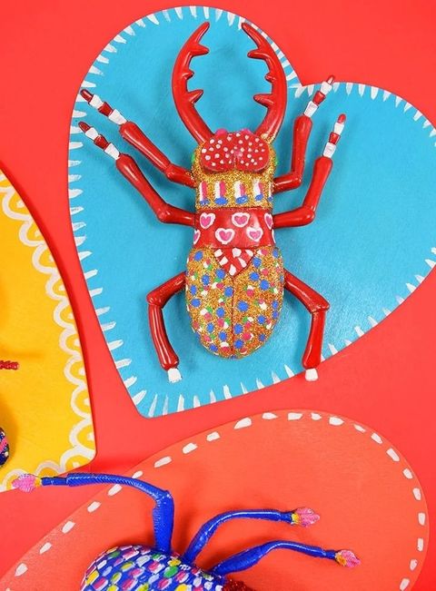 valentines day crafts love bug on top of paper heart