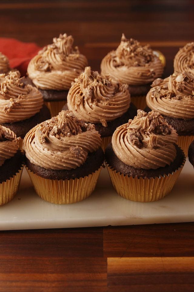 ferrero rocher stuffed cupcakes with icing on top