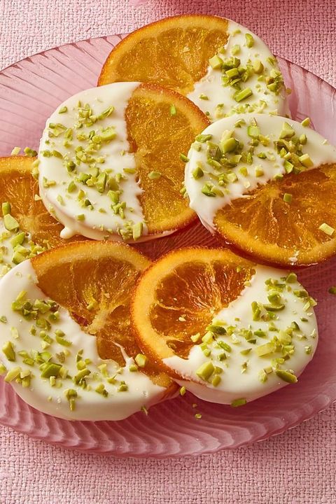 valentines day snacks orange slices with white chocolate and pistachio santa and elf cookies