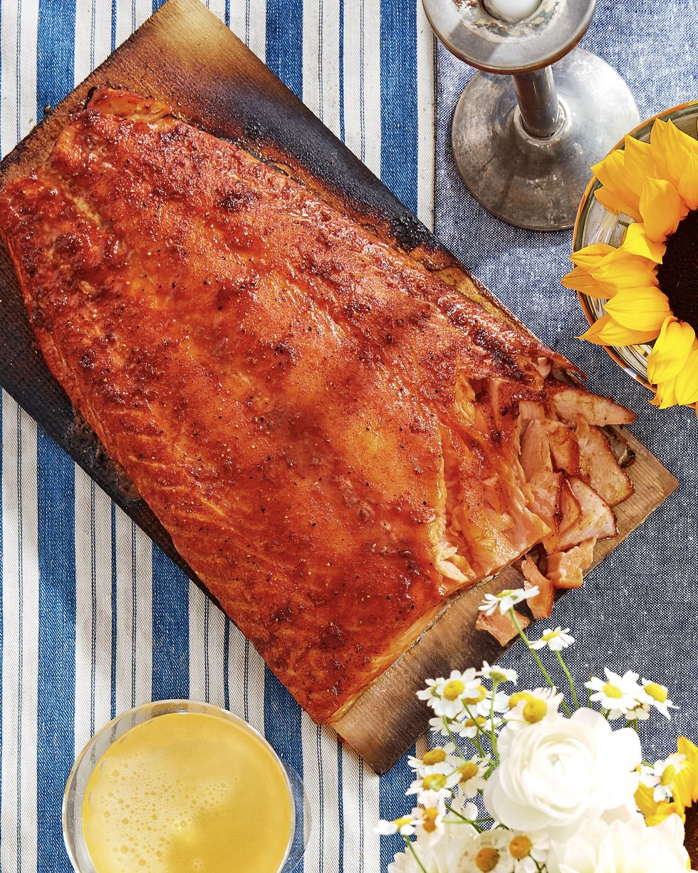 sweet and smoky cedar planked salmon on a wooden serving board