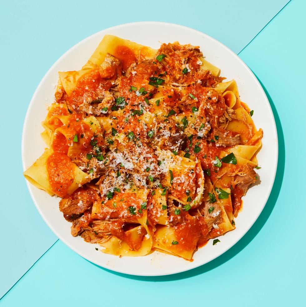 instant pot pork ragu with parmesan shavings on top