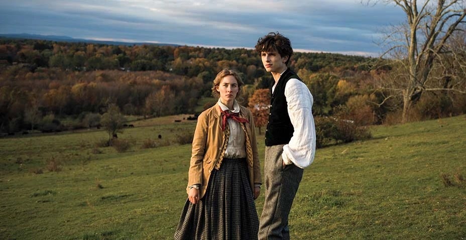 jo and laurie stand on a hill in a scene from little women, a good housekeeping pick for best valentines day movies for kids