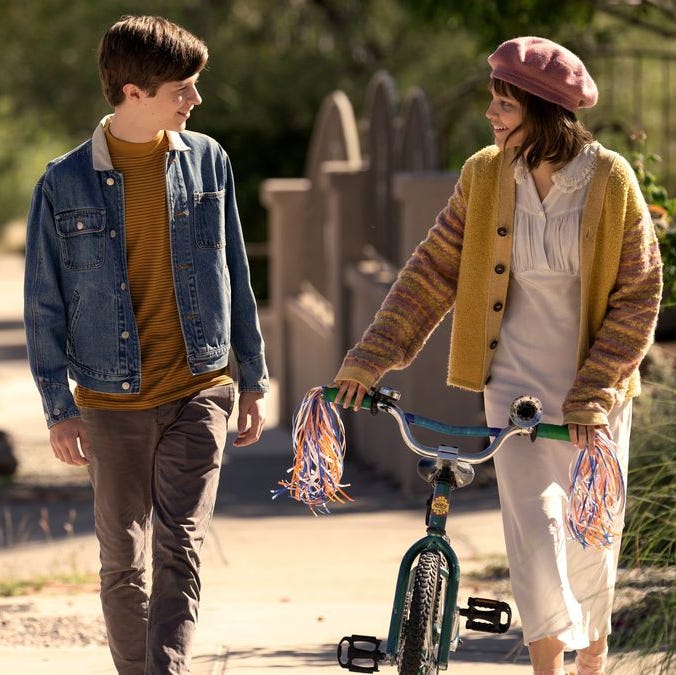 Leo and Stargirl walk home together in a scene from Stargirl, a Good Housekeeping pick for best Valentine's Day movies for kids leo and stargirl walk home together in a scene from stargirl, a good housekeeping pick for best valentine's day movies for kids