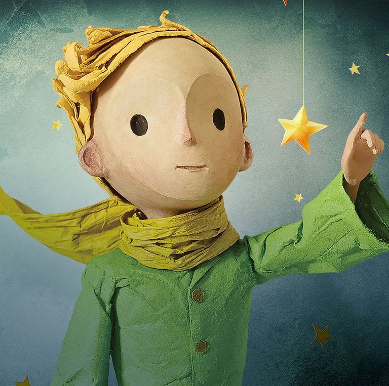 the little prince points at the stars in a promotional image for the little prince, a good housekeeping pick for best valentine's day movies for kids