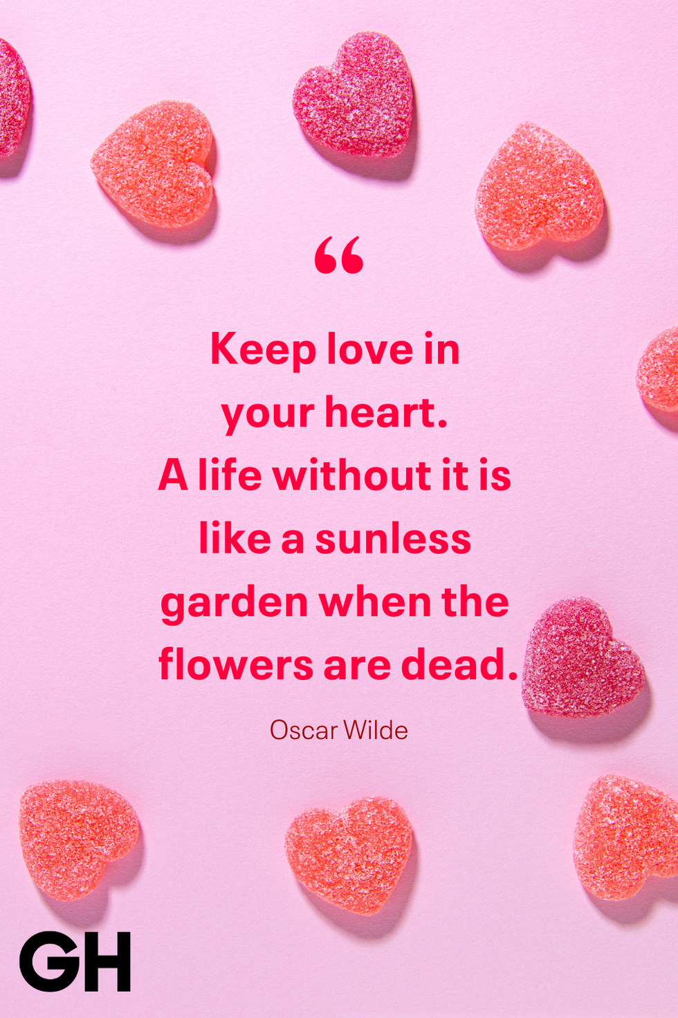 quote about love with candy hearts on a pink background