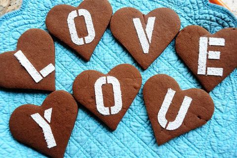 chocolate valentine cookies with love you letters on blue background