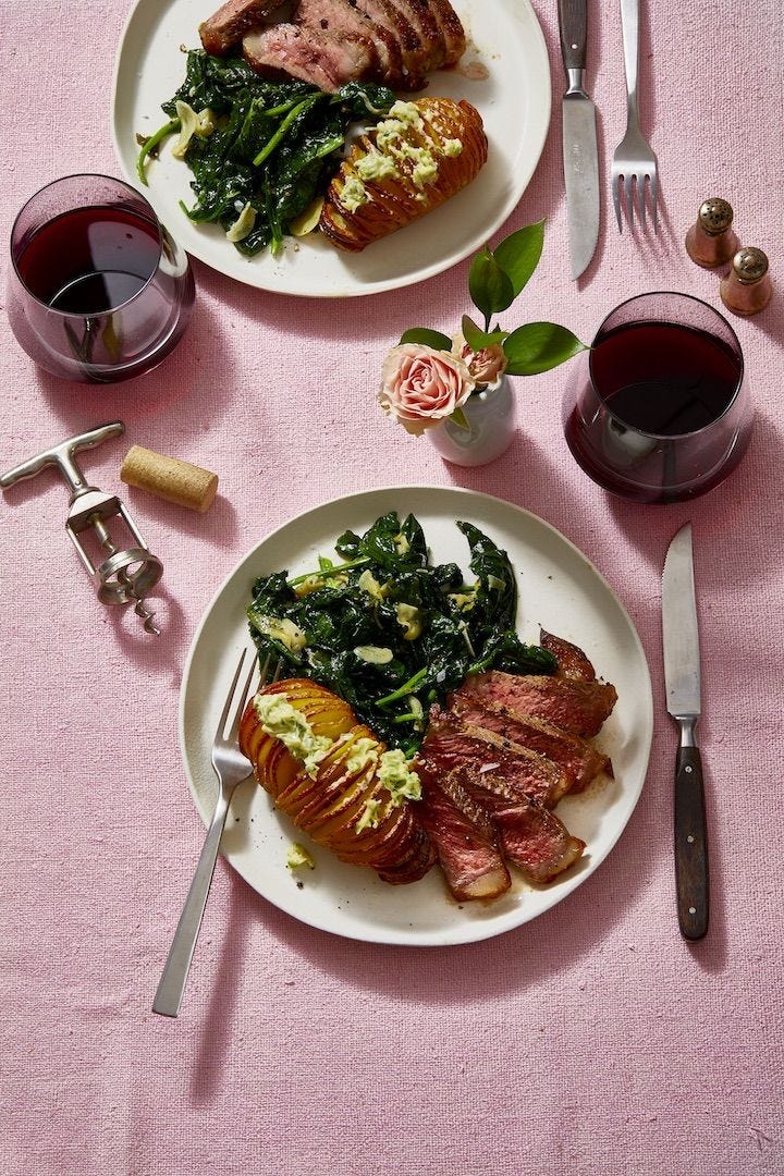 hasselback potatoes with steak and wilted greens