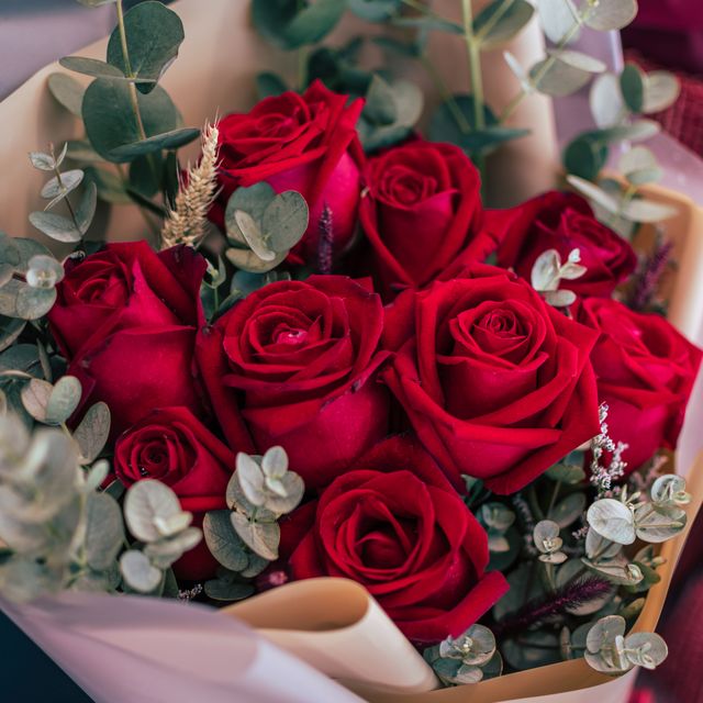 red roses with eucalyptus bouquet