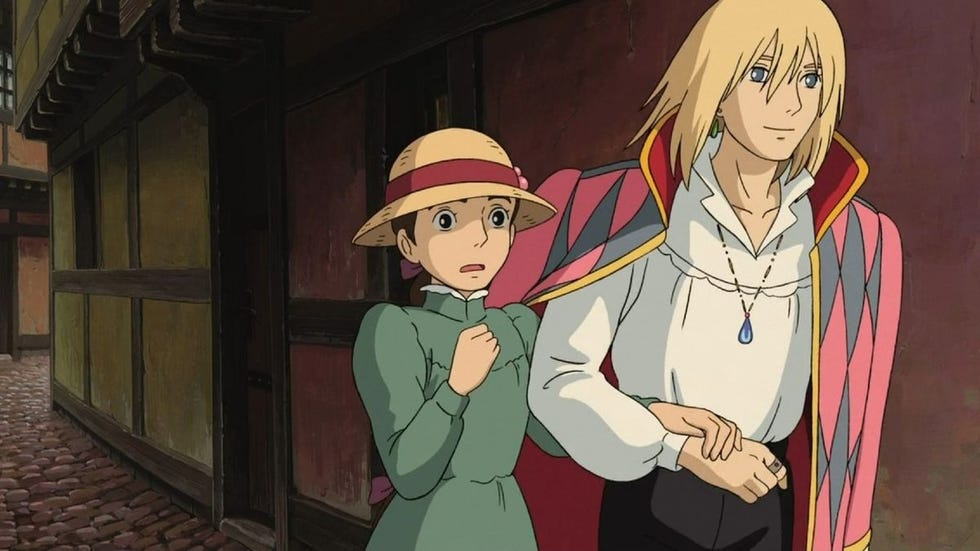 a worried sophie is escorted by a smiling howl in a scene from howl's moving castle