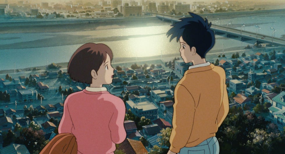 two figures overlooking a cityscape with a river and bridge in a scene from whispers of the heart