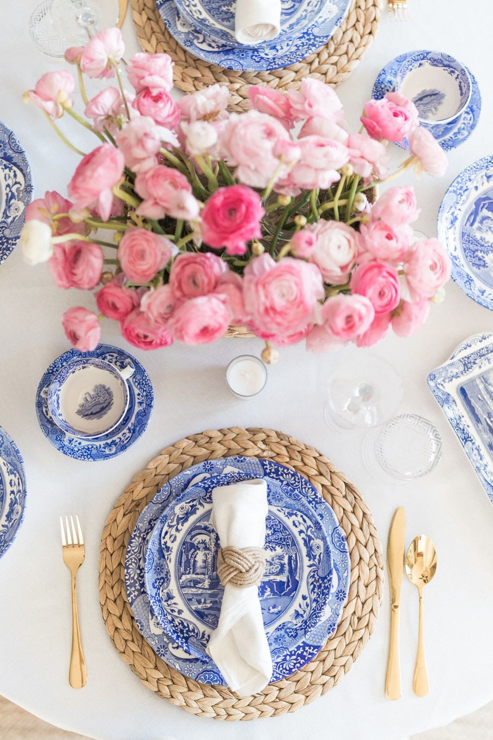 a table with plates and flowers