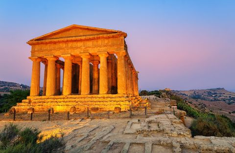 antique greek temple of concordia in the valley of temples, agrigento, sicily, italy, on sunset