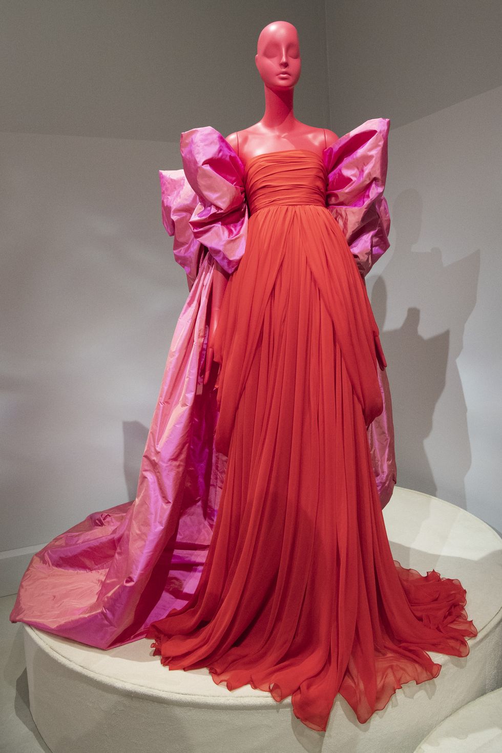Dress, Pink, Clothing, Gown, Shoulder, Fashion, Haute couture, Figurine, Costume design, Ruffle, 