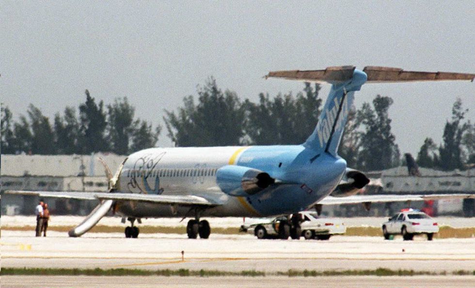 a valujet plane sits on the tarmac at miami intern