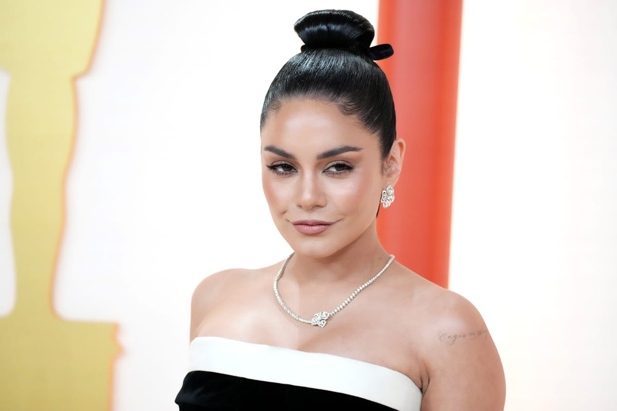 Vanessa Hudgens wears flower in hair on couple's trip to Antigua