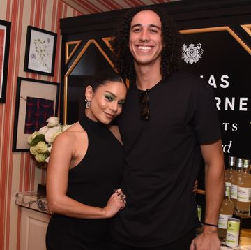 vanessa hudgens and cole tucker in late 2022, both wearing black and smiling for the camera