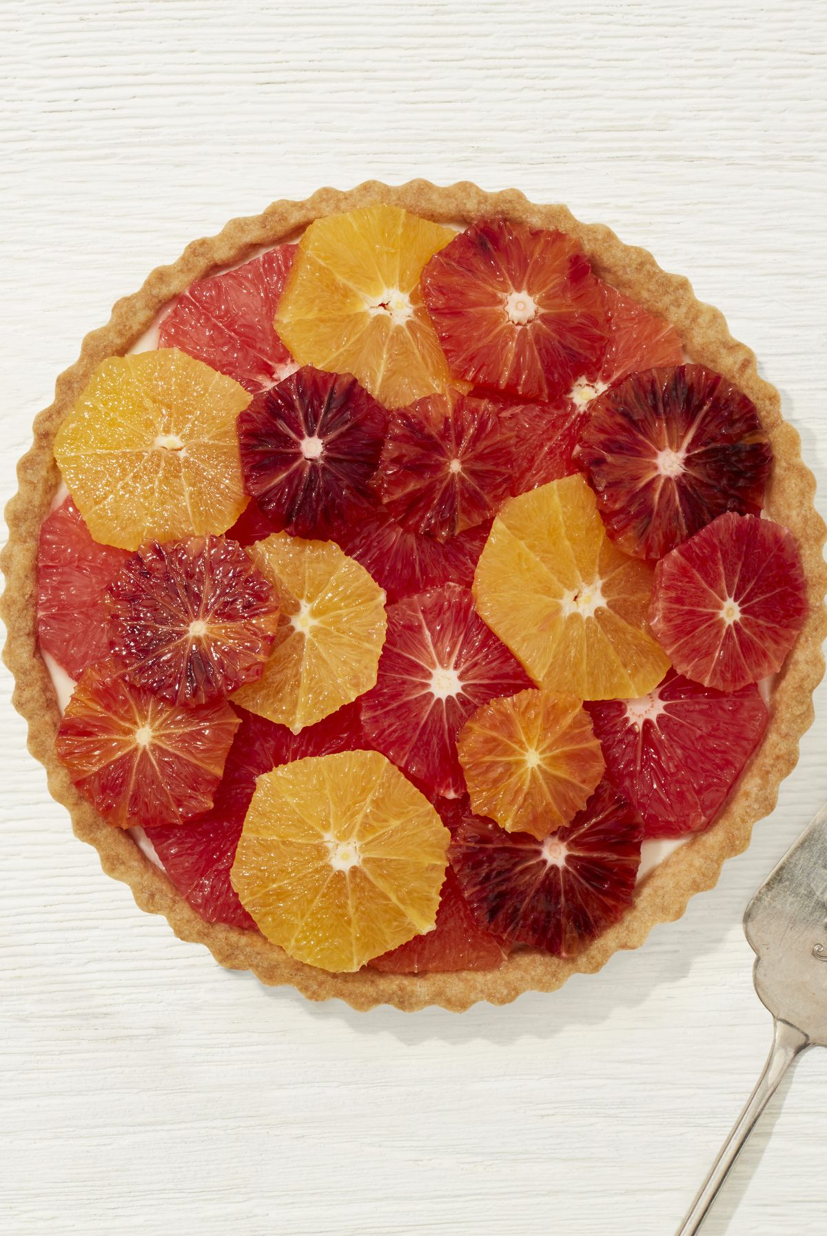 vanilla tart with geometric citrus design on top